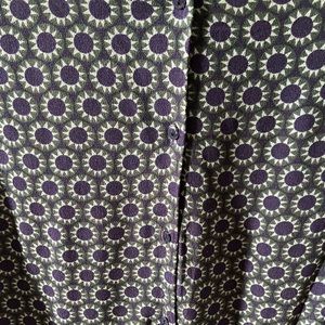 H&M blouse with a button down split back. Size small.